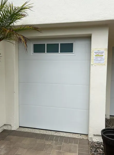 White garage door with windows installed by our team