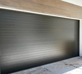 Black flush-panel garage door
