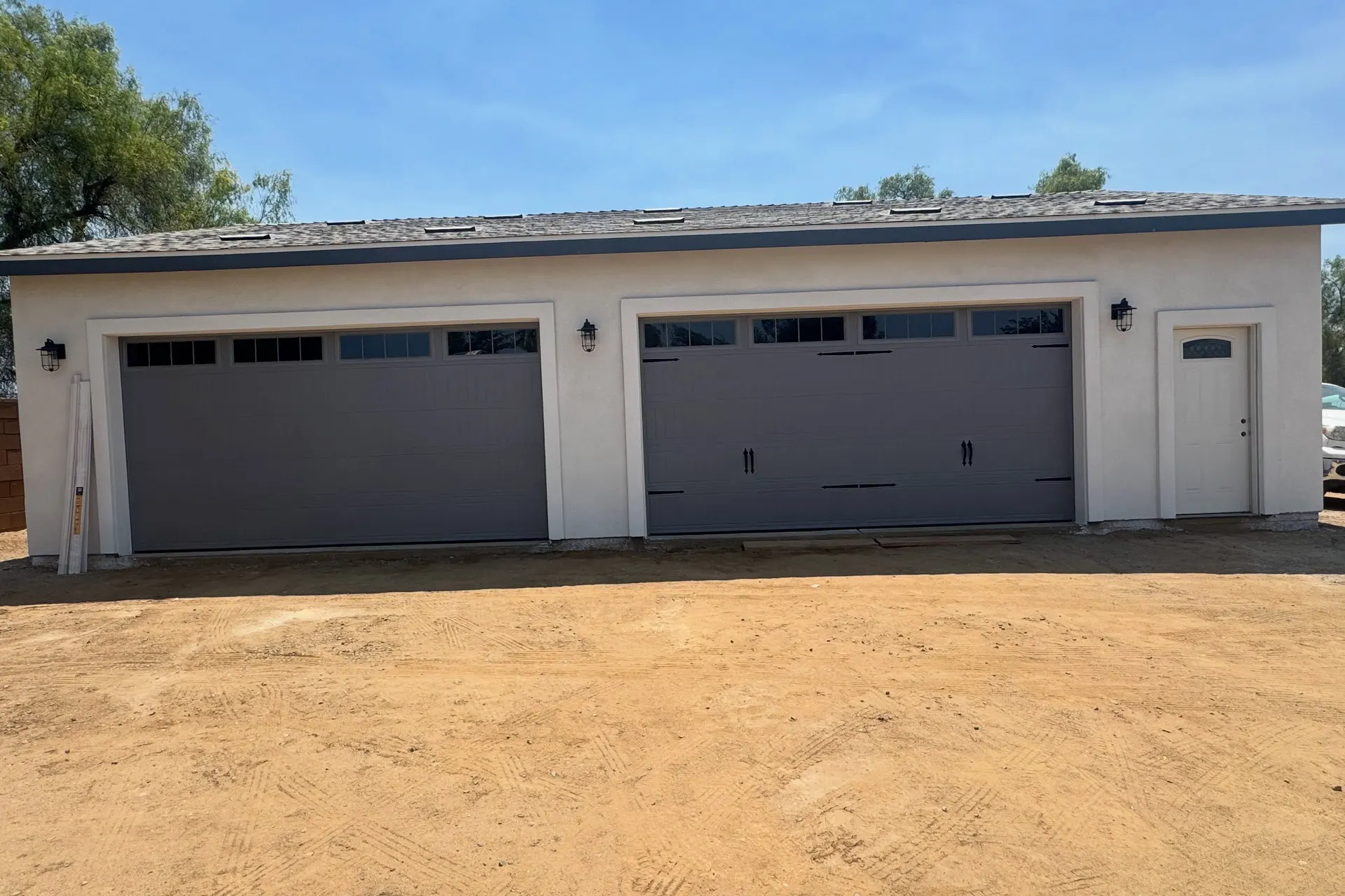 Detached garage with two new garage doors