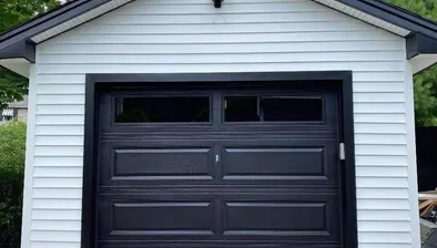 Garage door repair technician at work