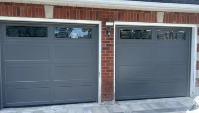Two-car garage doors after spring replacement