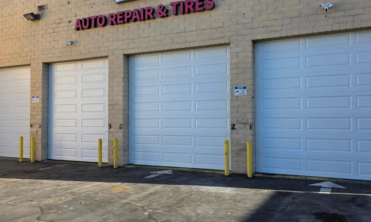 Commercial sectional garage doors on an auto repair shop in Costa Mesa