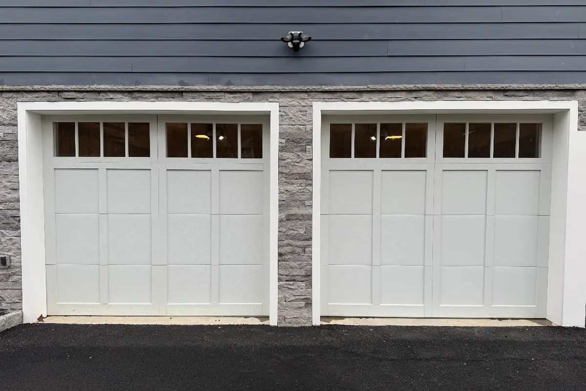 White carriage-style garage doors with window lites