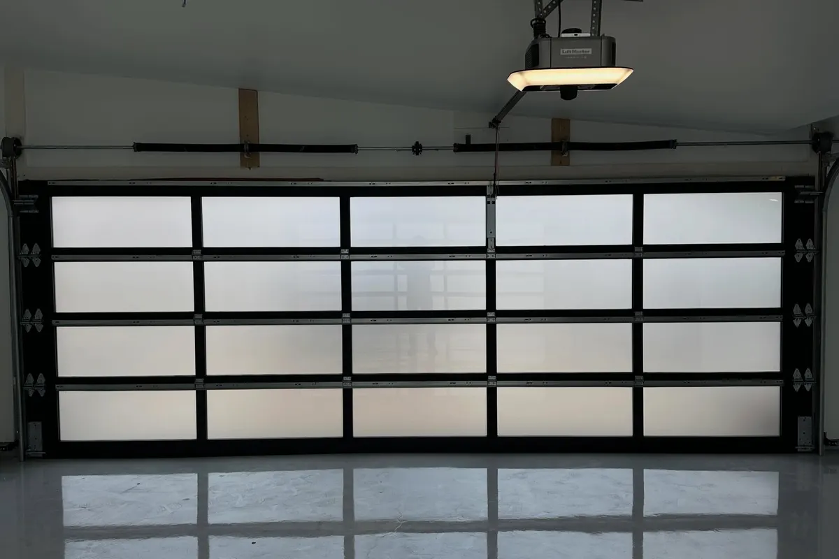 Glass garage door running smoothly after maintenance