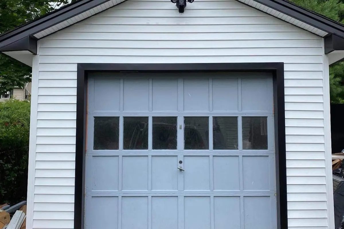 Single garage door with window section before panel work