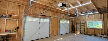 Detached garage door with springs and opener rail