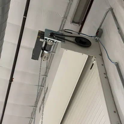 Rolling door guide and cable drum hardware