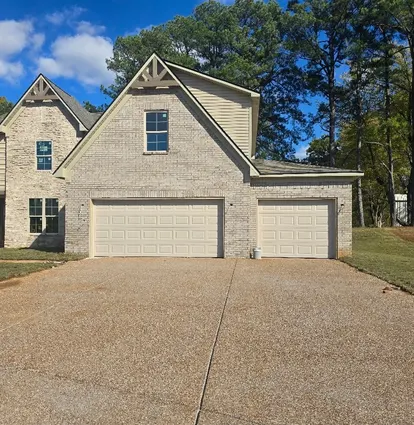 Two-car garage door on a suburban home after repair