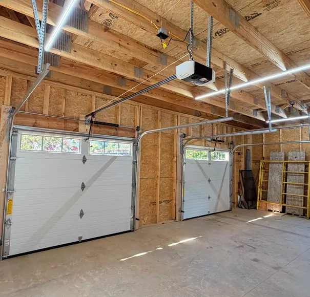 Detached garage with new garage door and opener